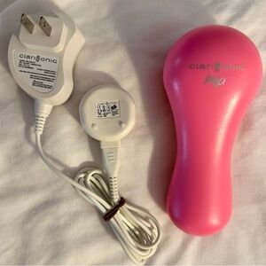 Clarisonic Mia Facial Sonic Cleanser with charging cord.